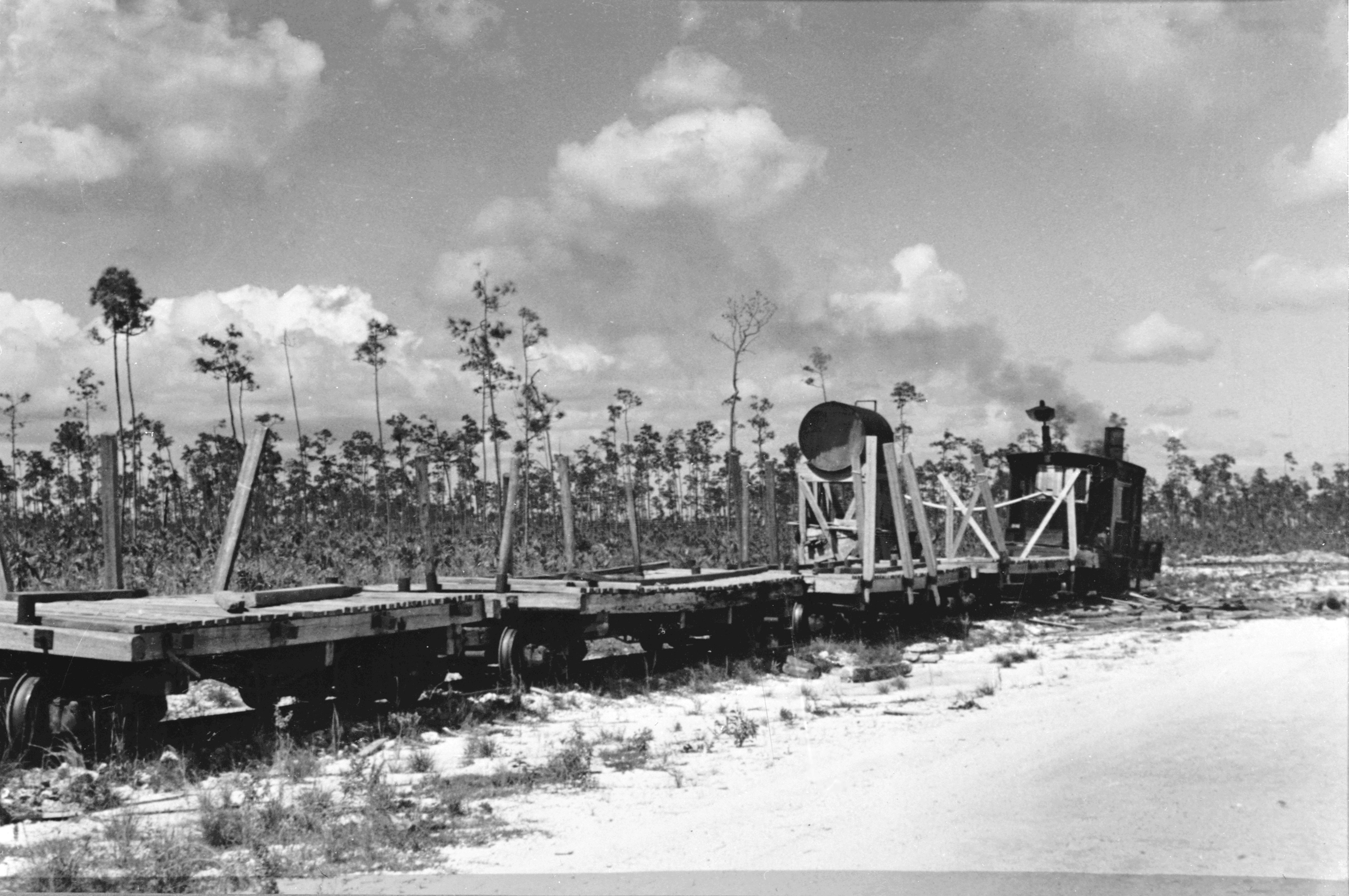 Locomotive Number 5 with sway-backed flat cars