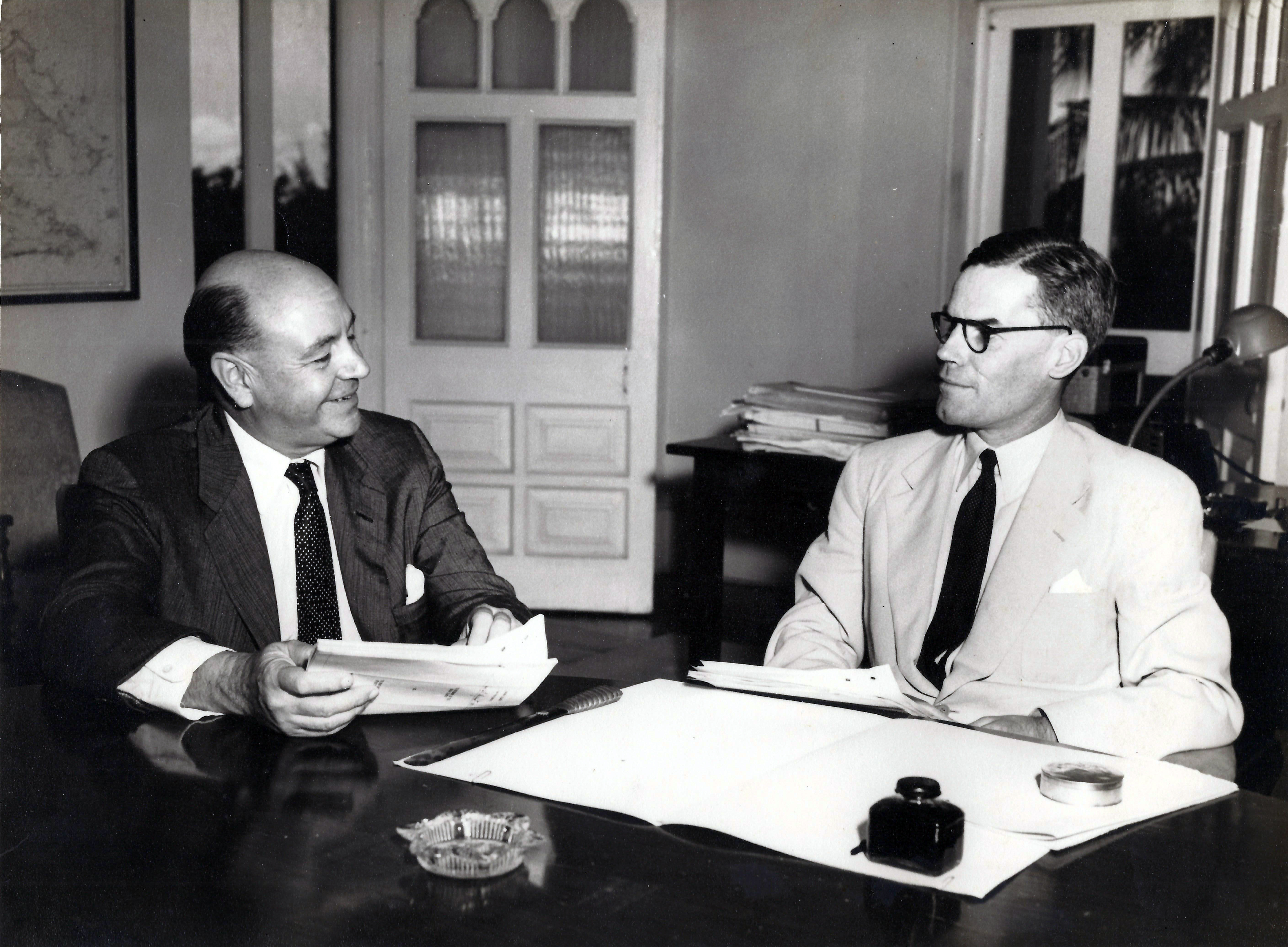 Wallace Groves and acting governor Gardner-Brown signing the Hawksbill Creek Agreement, 1955
