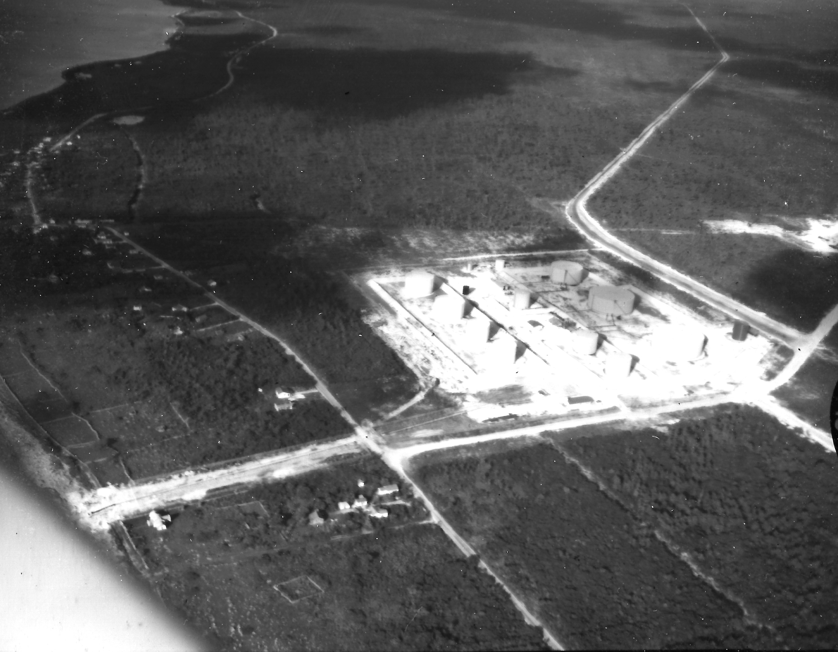 Aerial view of harbour and Freeport Bunkering, 1950's